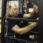 Alex Pravato, of Walworth, working on the iGen3 color digital printer at Xerox. Sept. 15, 2008